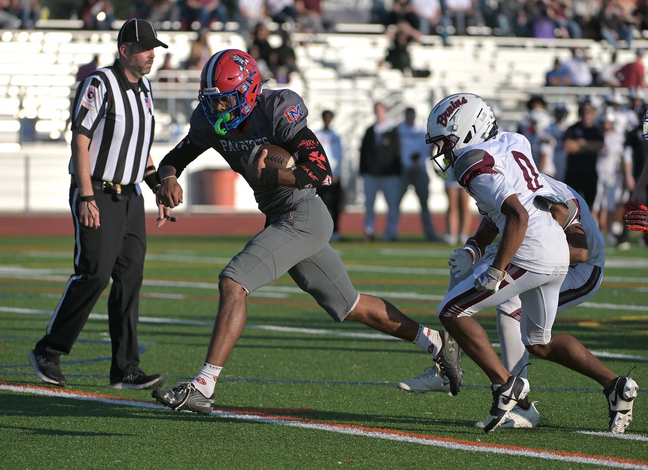 Old Mill Patriots quarterback Braylon Tucker #1 has a nice run for a touchdown in the first quarter. The Old Mill Patriots host the visiting Broadneck Bruins in high school football at the Severn Run High School. (Paul W. Gillespie/Staff)