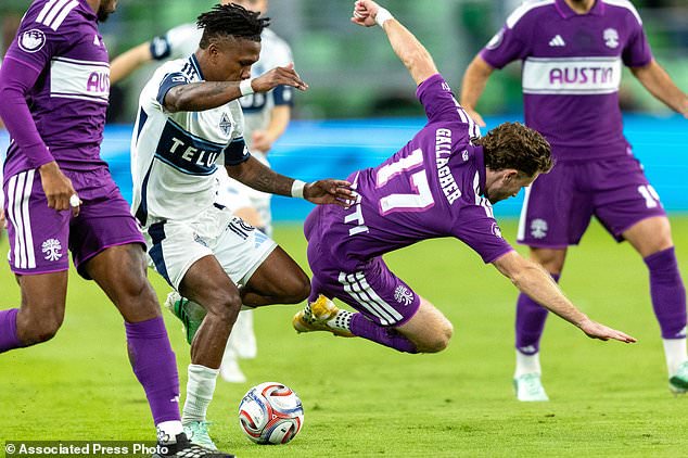 Vancouver Whitecaps defender Édier Ocampo (18) takes possession away from Austin FC defender Jon Gallagher (17) during the second half of an MLS soccer match in Austin, Texas, Saturday, Oct. 17, 2026. (AP Photo/Stephen Spillman)