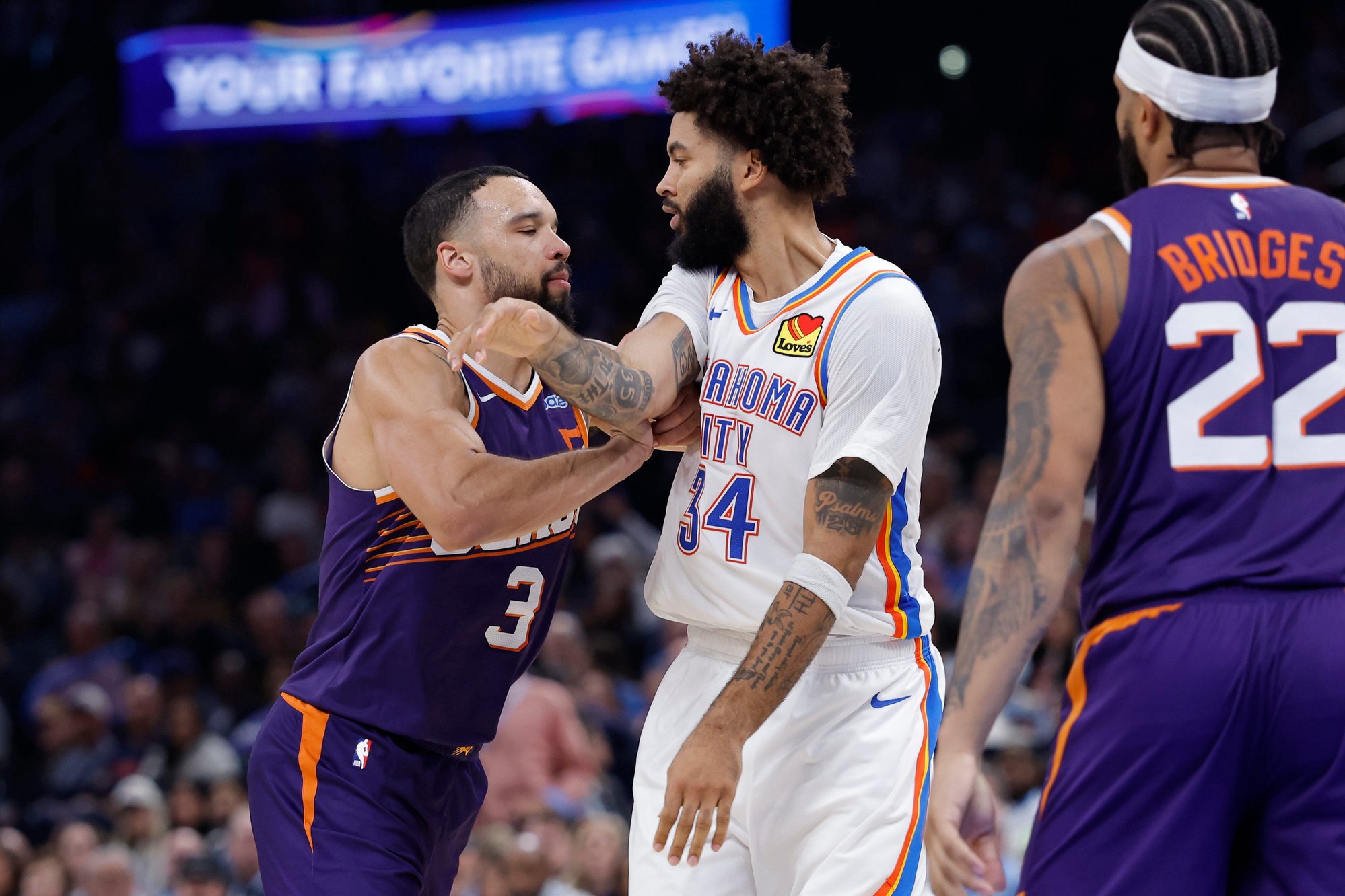 Oct 26, 2026; Oklahoma City, Oklahoma, USA; Phoenix Suns forward Dillon Brooks (3) pushes Oklahoma City Thunder guard Kenrich Williams (34) after a play during the second half at Paycom Center. Mandatory Credit: Alonzo Adams-Imagn Images
