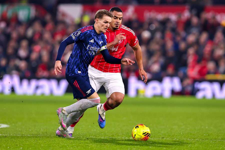 Arsenal's Martin Odegaard is put under pressure by Nottingham Forest's Murillo