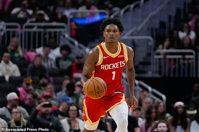 Houston Rockets guard Amen Thompson handles the ball during the first half of an NBA basketball game against the Milwaukee Bucks Wednesday, Oct. 28, 2026, in Milwaukee. (AP Photo/Kayla Wolf)