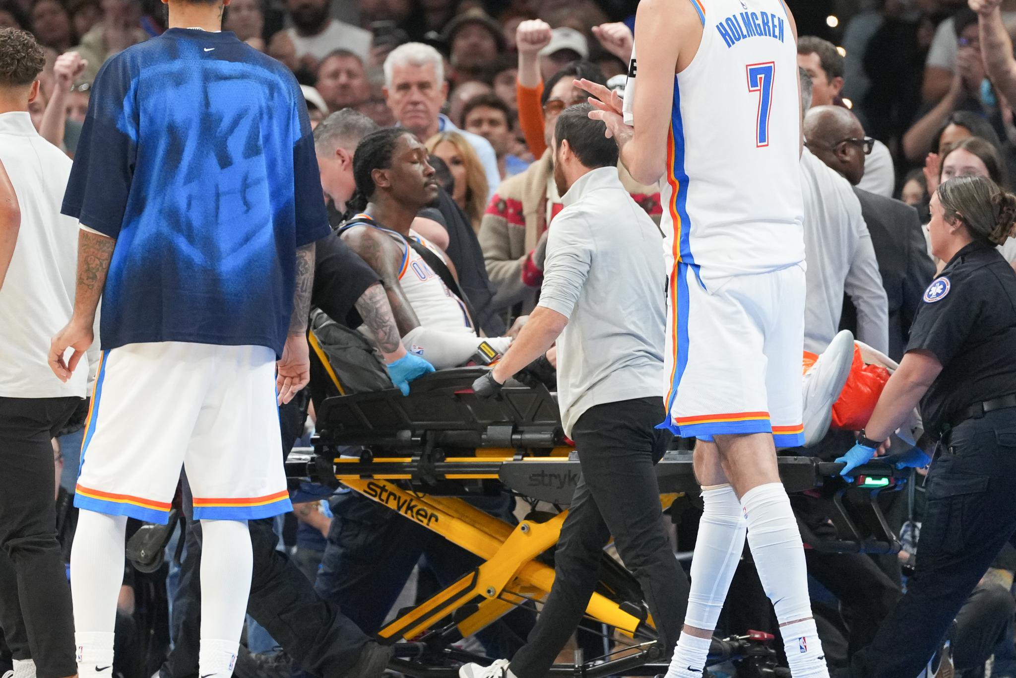 Oklahoma City Thunder guard Jalen Williams is taken off the court on a stretcher by medical staff.