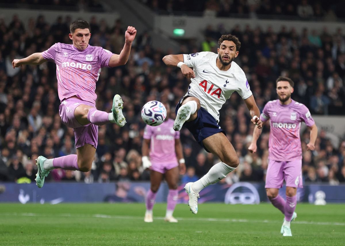 Coventry City's Bobby Thomas and Tottenham Hotspur's Omar Marmoush challenge for the ball
