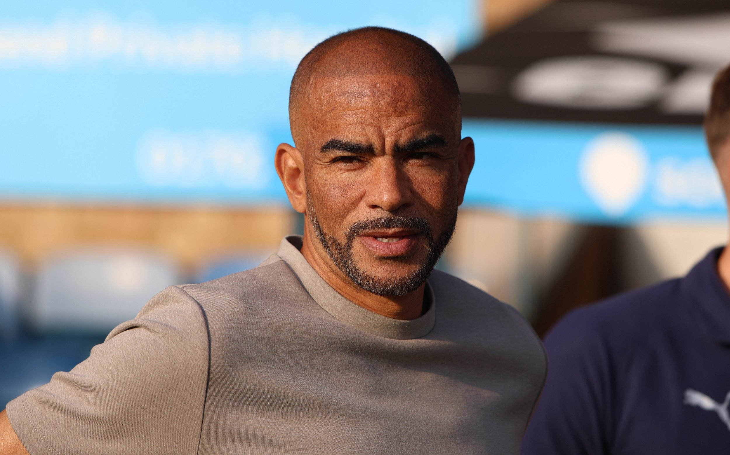 Kieron Dyer looks on from the dugout
