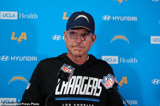 Los Angeles Chargers head coach Jim Harbaugh listens to a question during a news conference after an NFL football game against the Kansas City Chiefs in Kansas City, Mo., Sunday, Oct. 18, 2026. (AP Photo/Ed Zurga)