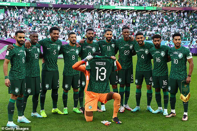 Saudi Arabia's players have paid tribute to their team-mate Yasser Al-Shahrani by holding up his No 13 shirt before their clash with Poland