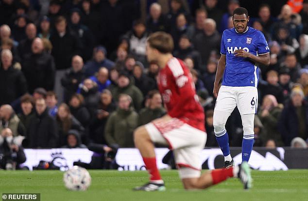 Issa Diop (right) can be seen standing while other players take the knee prior to Ipswich Town's clash with Nottingham Forest on Friday night