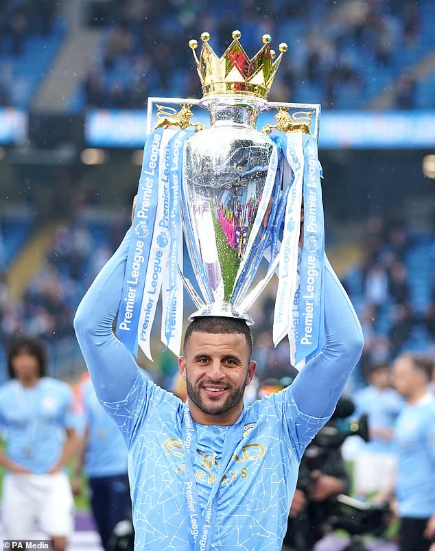 Kyle Walker lifts the Premier League trophy (Martin Rickett/PA).