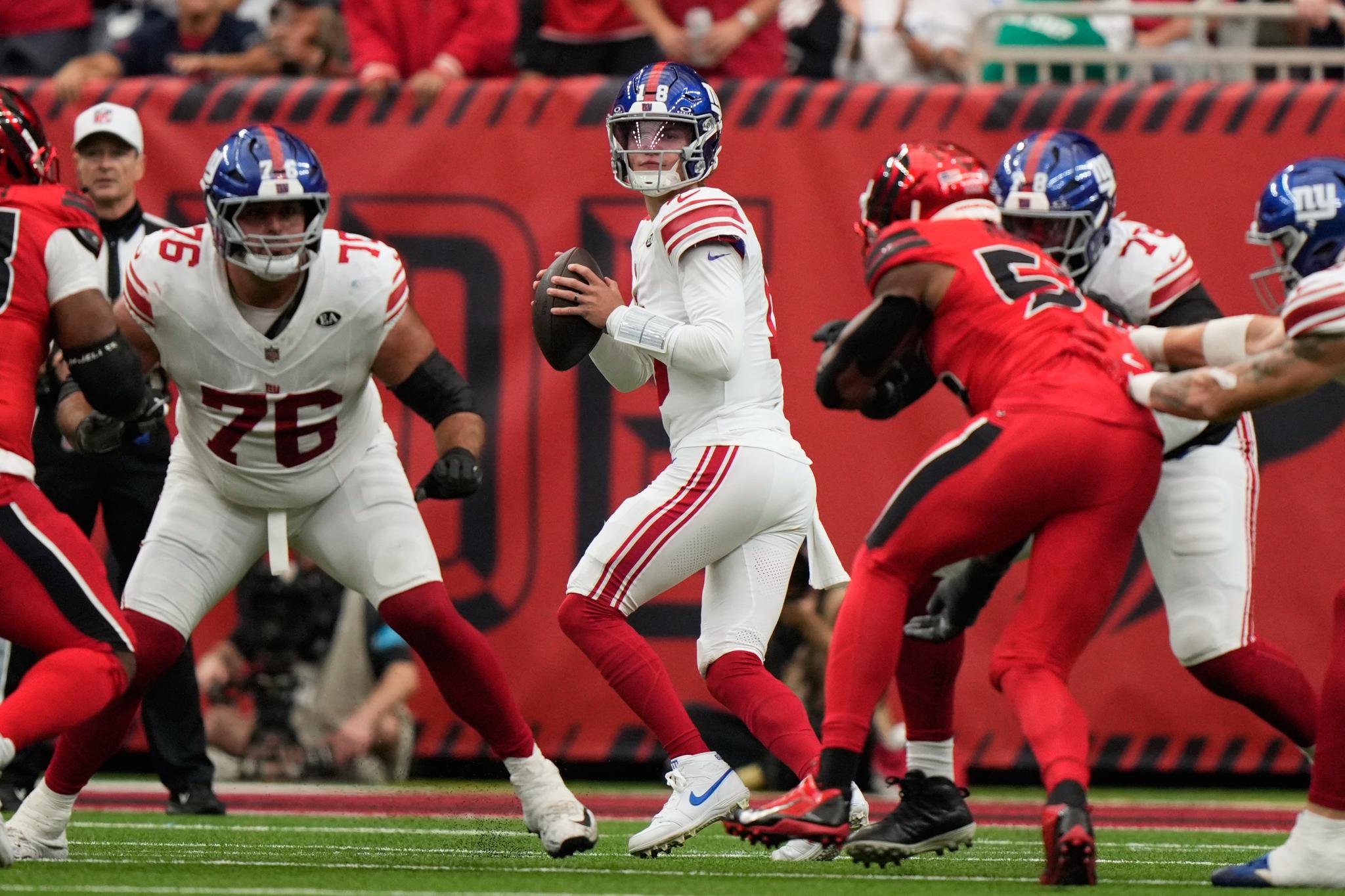 New York Giants quarterback J.J. McCarthy looks to pass during a game against the Houston Texans.