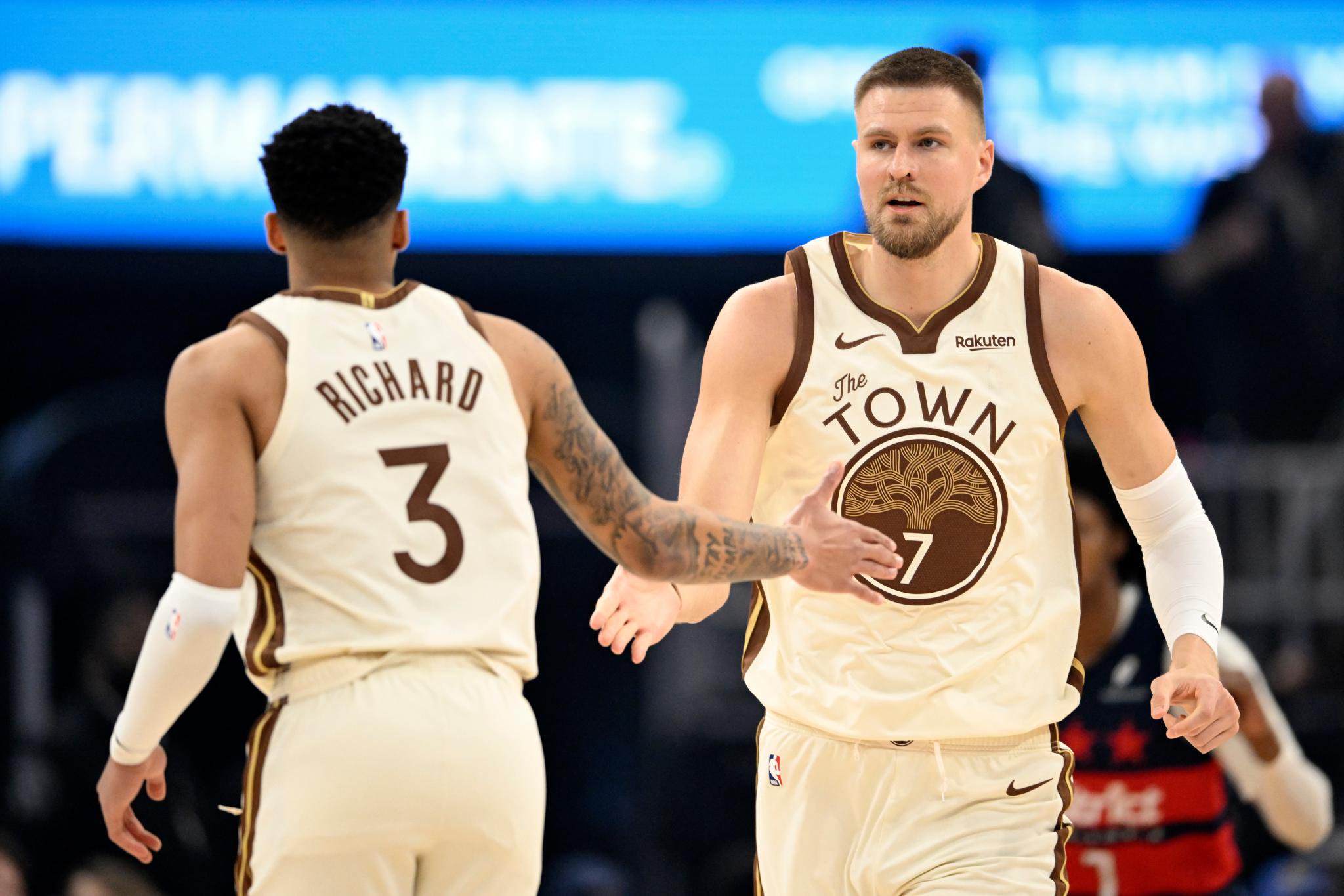 Basketball players Quinten Post and Will Richard of the Golden State Warriors celebrate during a game.