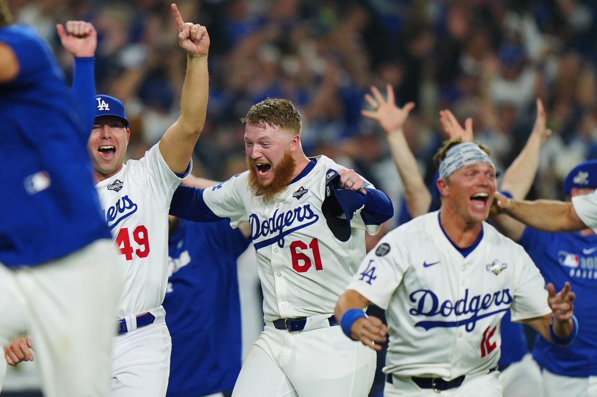 Winning Dodgers pitcher Will Klein (61) celebrates with teammates Blake Treinen (49) and Alex Call (12).