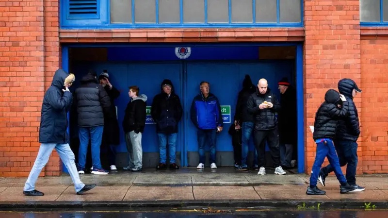 Fans taking shelter at Ibrox