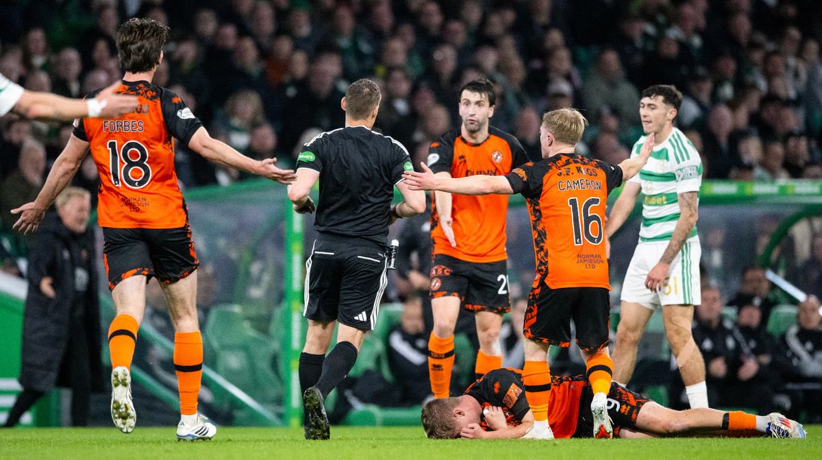 Dundee United's Zac Sapsford goes down after a challenge by Celtic's Colby Donovan