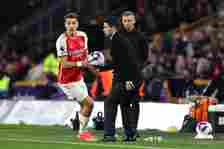 Mikel Arteta the head coach / manager of Arsenal passes the ball to Jakub Kiwior of Arsenal during the Premier League match between Wolverhampton W...
