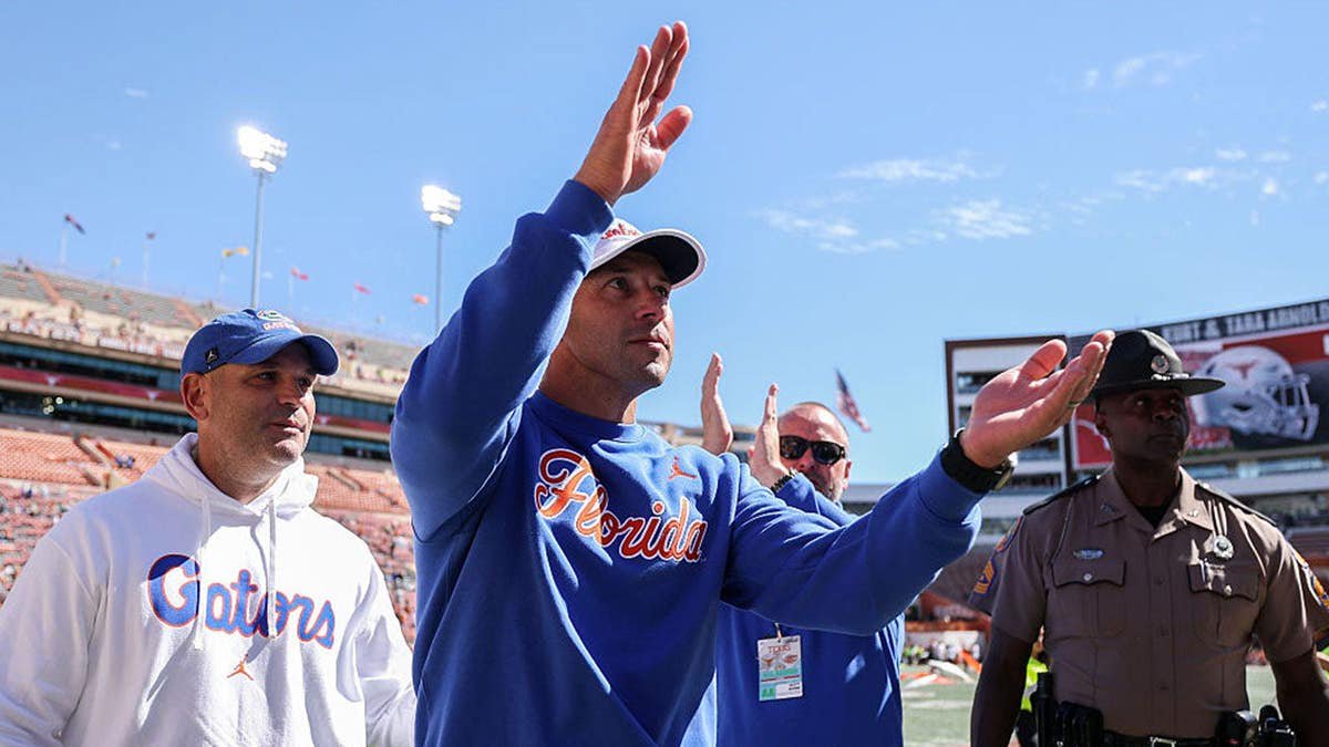 Jon Sumrall celebrates after defeating Texas Longhorns at stadium.