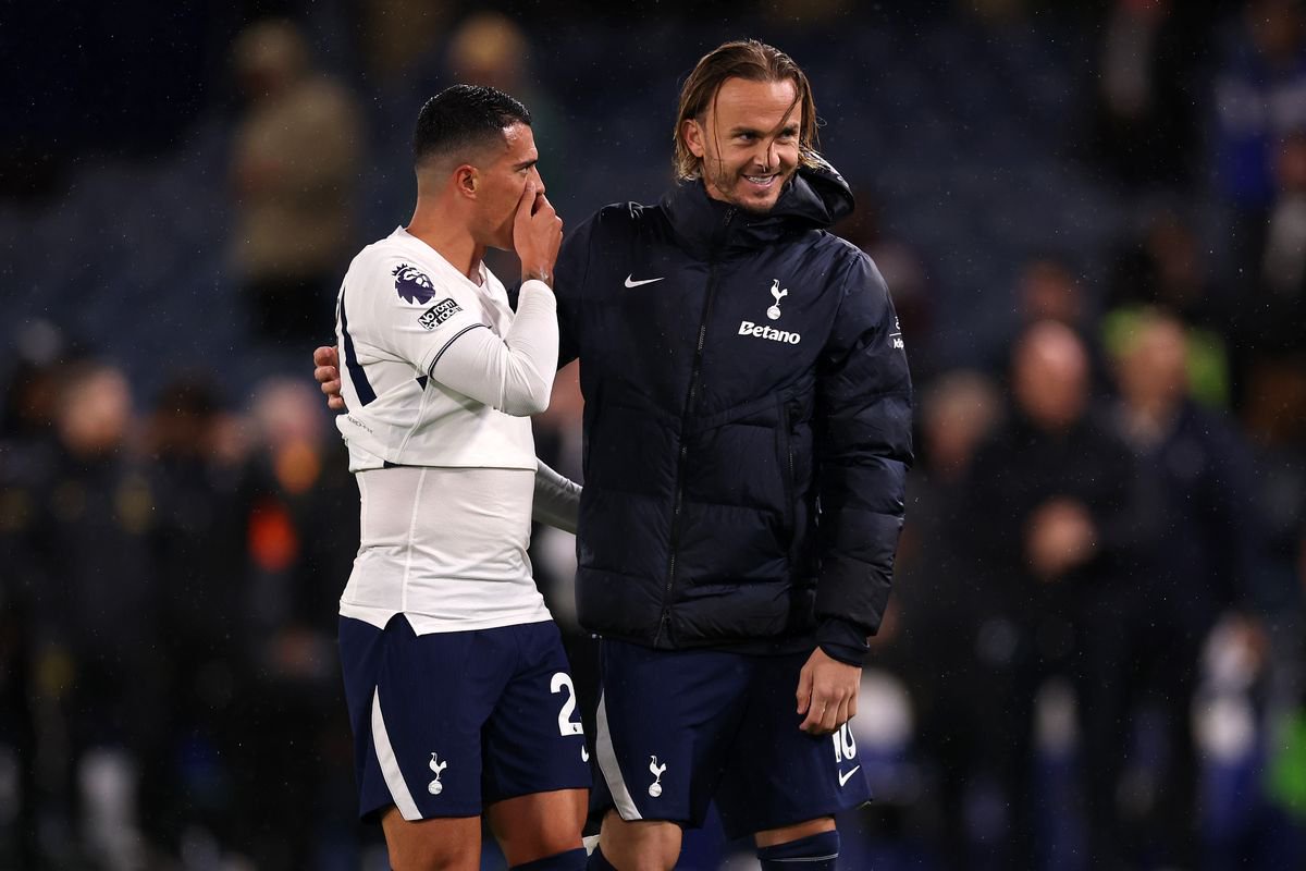 Pedro Porro and James Maddison celebrate after the Premier League match between Chelsea and Tottenham Hotspur at Stamford Bridge