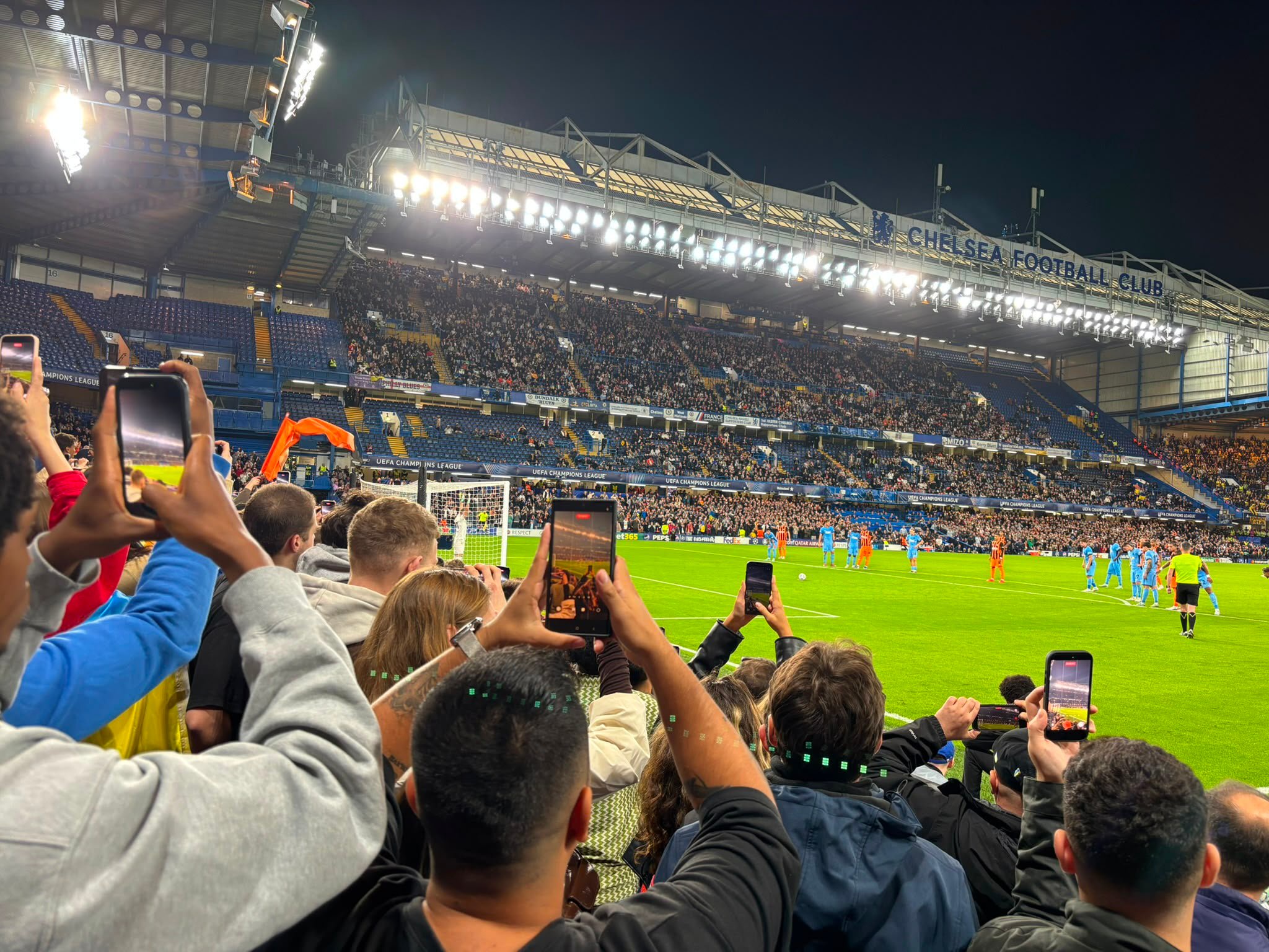 Fans ready their phones for a first-half penalty (and yes, our reporter is one of them)