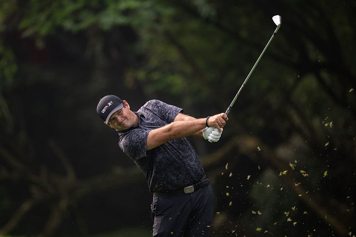 Patrick Reed hits an iron shot