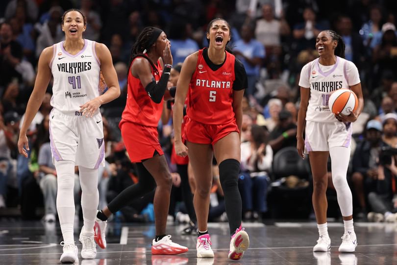 Angel Reese reacts after making a bucket