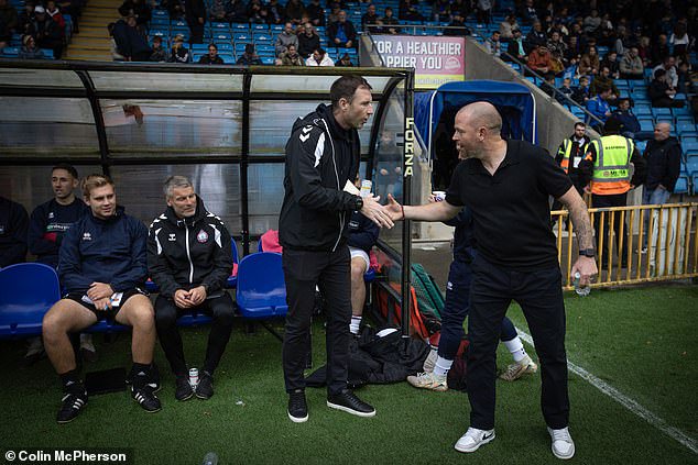 Managers Mike Williamson (left, South Shields) and John McGrath (right, Halifax) shake hands