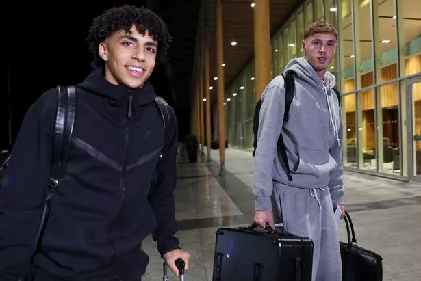 Rico Lewis and Cole Palmer of England arrive