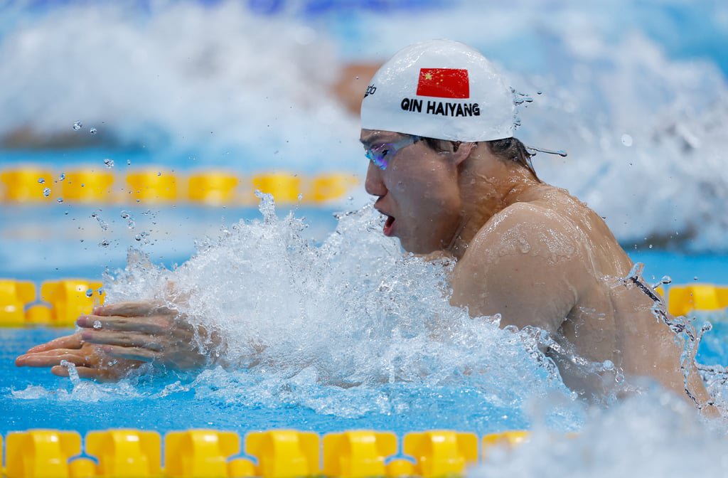 World champion Qin Haiyang, seen here winning the Asian Games 50m breaststroke final, had a slower 100m breaststroke time than Hu Rundong at the same age. Photo: Xinhua