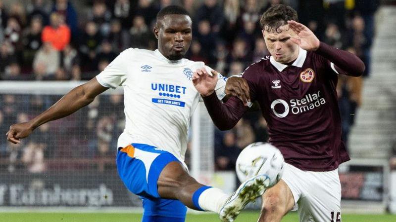 Rangers' Olwethu Makhanya and Heart of Midlothian's Josh McPake in action