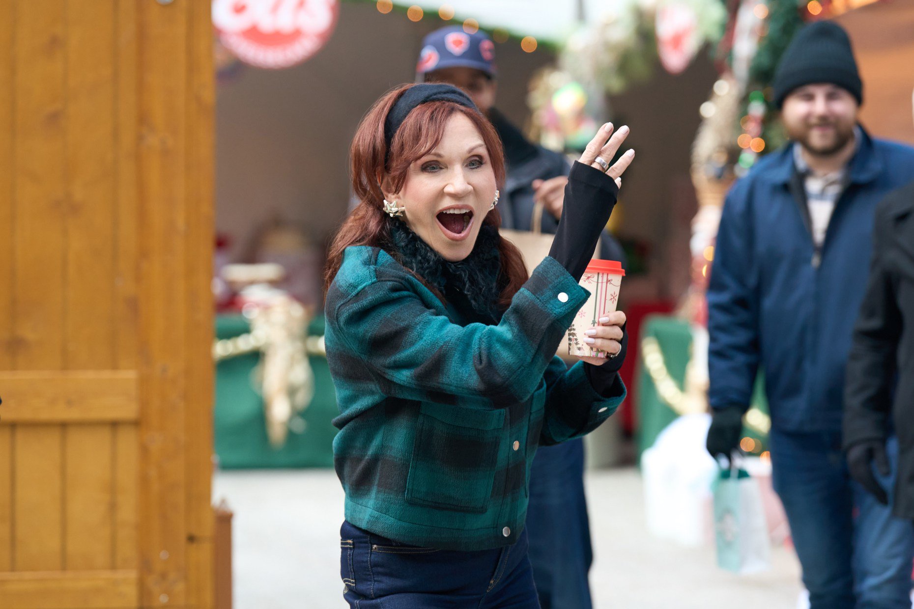 Mary (Marilu Henner) plays cornhole in "Holiday Touchdown: A Bears Love Story" (Elizabeth Sisson/Hallmark Media)