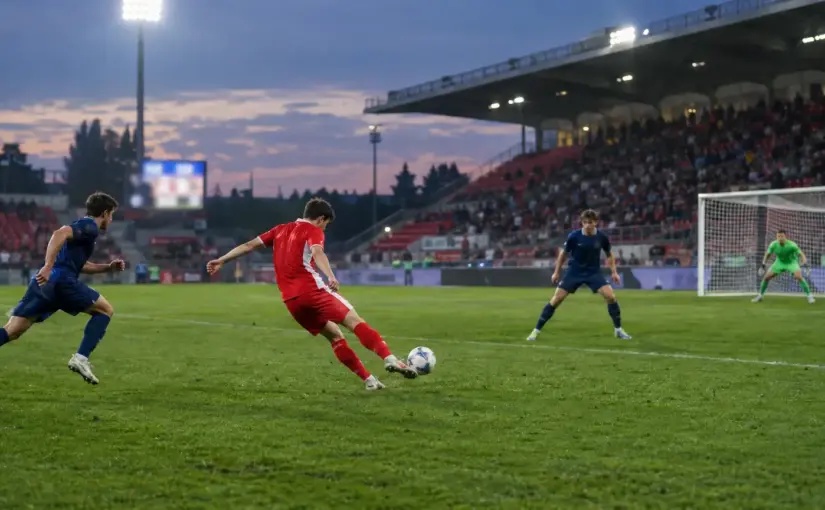 Anonymous footballers contest a Serie A match at Monza’s U-Power Stadium under evening floodlights