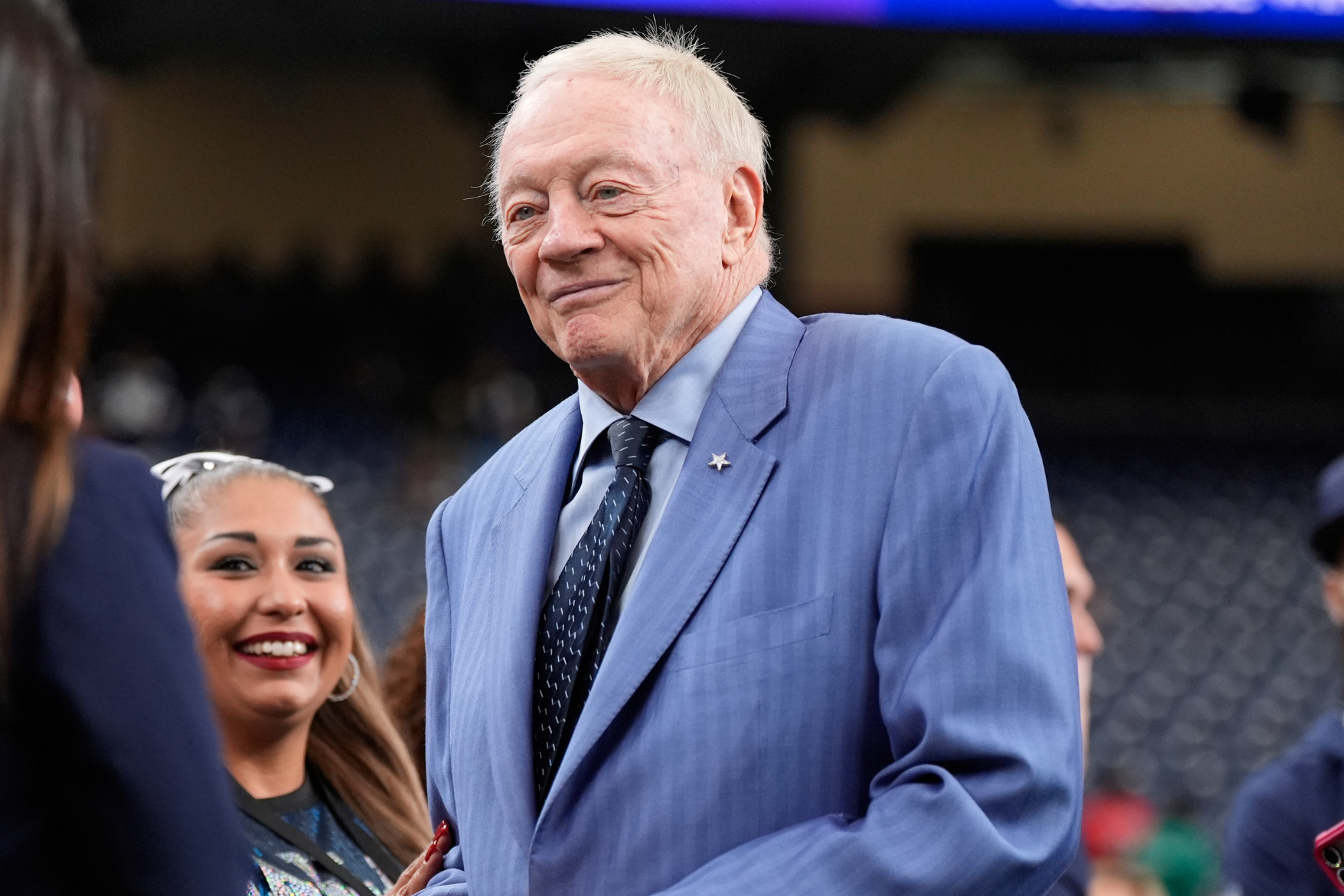 Jerry Jones speaks to people on the field before the Dallas Cowboys vs. Houston Texans game.