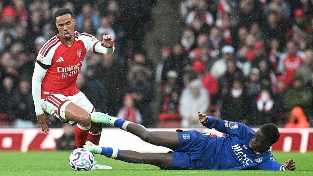 Gabriel on the ball for Arsenal whilst Thierno Barry is on the floor