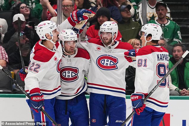 Montréal Canadiens' Chris Kreider (22), Alex Newhook (15), Noah Dobson (53) and Oliver Kapanen (91) celebrate after Newhook scored against the Dallas Stars in the second period of an NHL hockey game in Dallas, Thursday Oct. 29, 2026. (AP Photo/Tony Gutierrez)