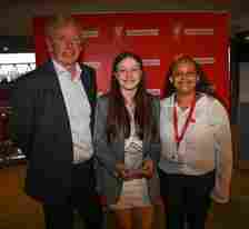 Charlotte, winner of LFC Foundation Dignity and Young Person of the Year awards with former LFC player David Fairclough and Chesney Taylor from the foundation