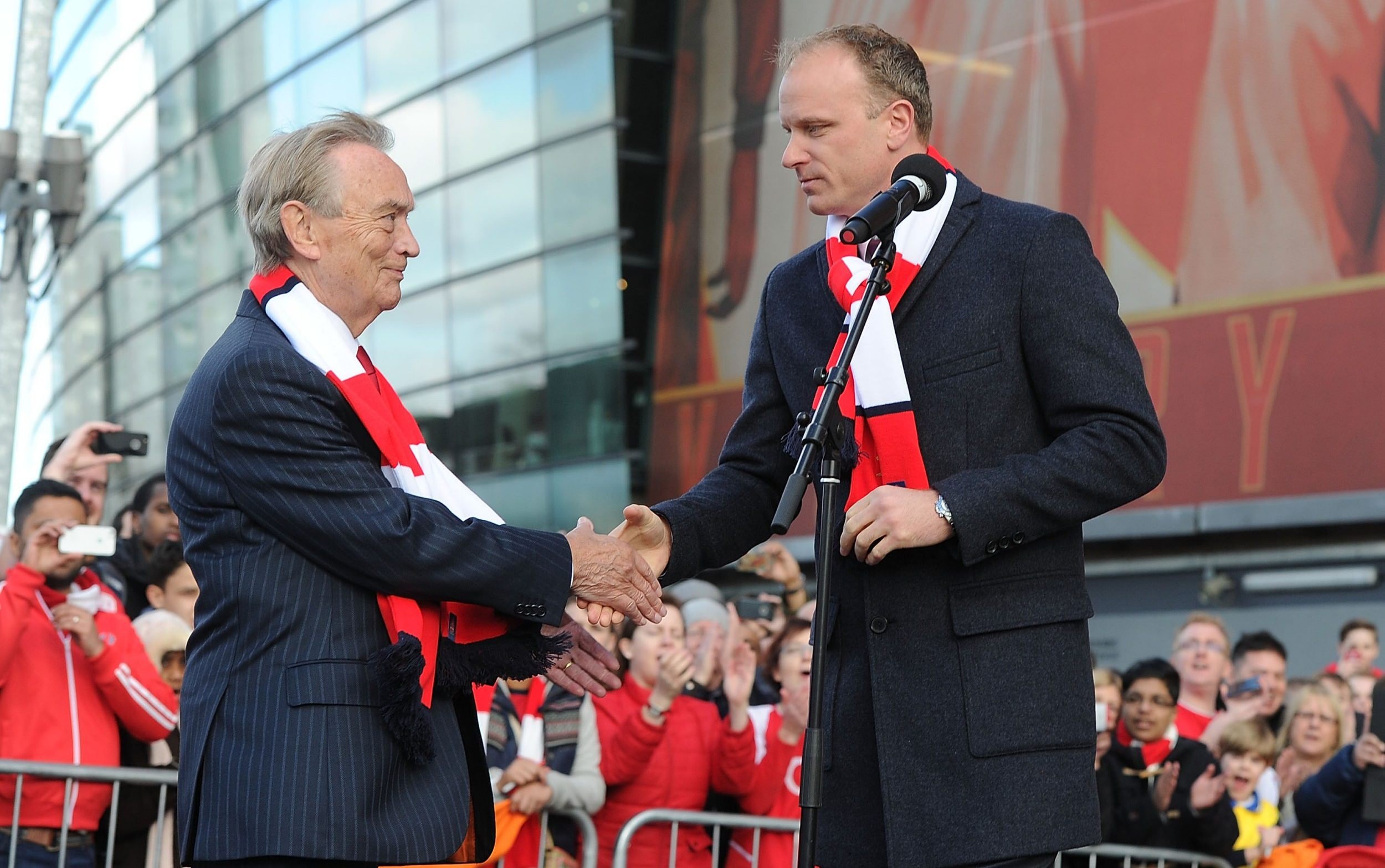 rsenal director Ken Friar with Dennis Bergkamp at the unveiling of a statue