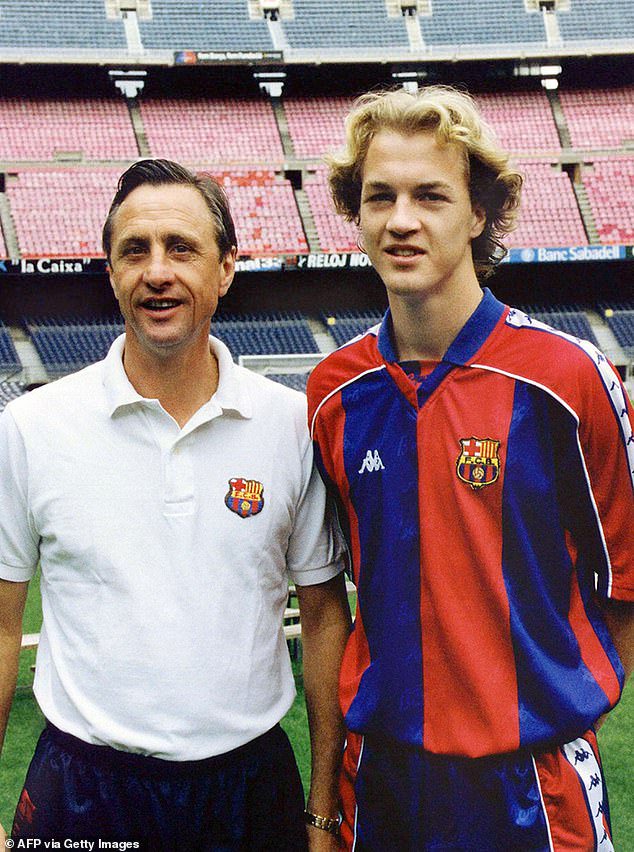 Jordi alongside his father Johan at the Camp Nou in the mid-1990s - Cruyff would depart a year later