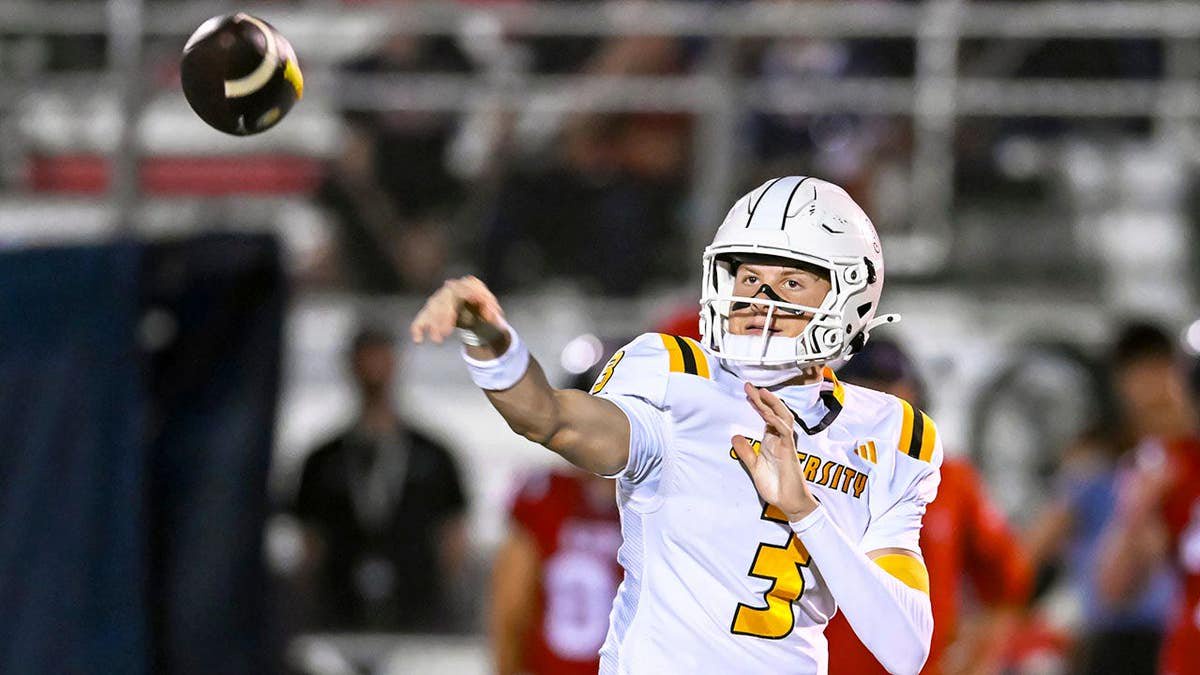 Knox Kiffin No. 3 runs with the ball during a football game.