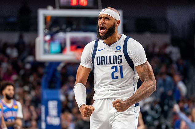Dallas Mavericks forward Daniel Gafford celebrates after a 3 point basket by guard Max Christie during the first half of an NBA basketball game against the Oklahoma City Thunder Wednesday, Oct. 28, 2026, in Dallas. (AP Photo/Jeffrey McWhorter)