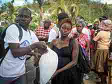 Haitian people getting food aid