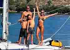 The couple were so sick of their 9-5 jobs they sold up to live life on a yacht with their two boys