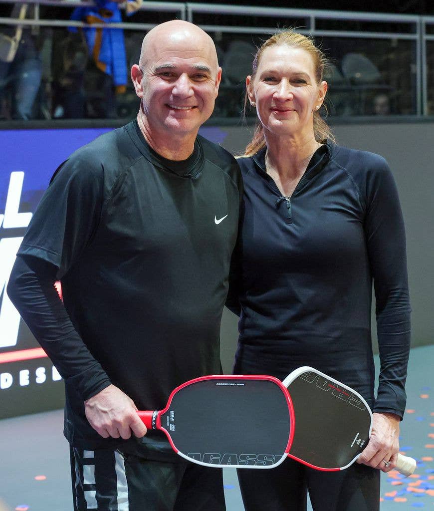 Andre Agassi (L) and Steffi Graf pose on the court after winning the Pickleball Slam 3 championship at Michelob ULTRA Arena on February 16, 2025 in Las Vegas, Nevada. 