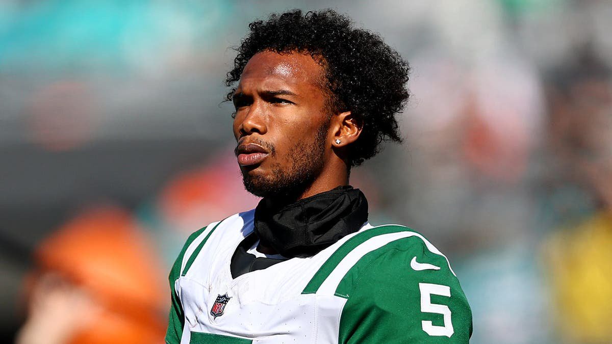 Garrett Wilson, New York Jets wide receiver, looks on during warmups before a game.
