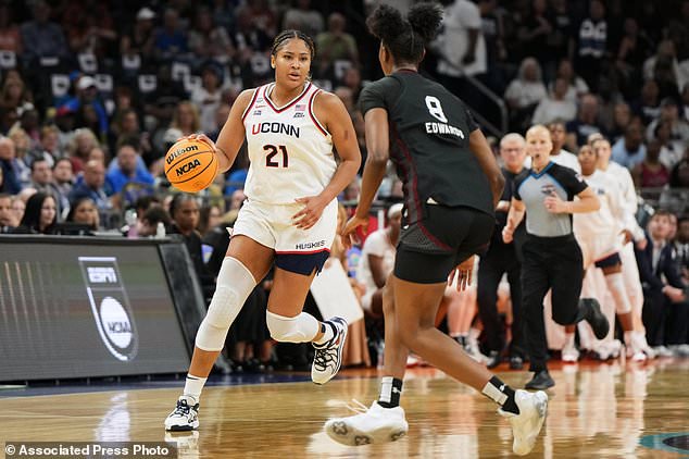 FILE - UConn forward Sarah Strong (21) works against South Carolina during the first half of a woman's NCAA college basketball tournament semifinal game at the Final Four, April 3, 2026, in Phoenix. (AP Photo/Rick Scuteri, File)