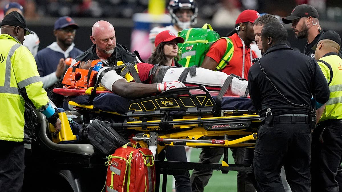 Kendal Daniels is taken off the field after an injury during an NFL game in Atlanta.