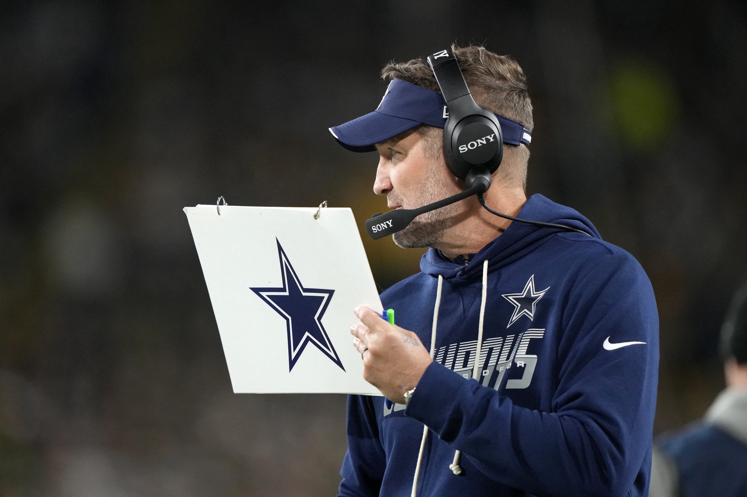 Oct 18, 2026; Green Bay, Wisconsin, USA;  Dallas Cowboys head coach Brian Schottenheimer looks on during the second half against the Green Bay Packers at Lambeau Field.  Mandatory Credit: Jeff Hanisch-Imagn Images