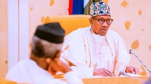 VP Osinbajo looks on as Buhari addresses a cabinet meeting