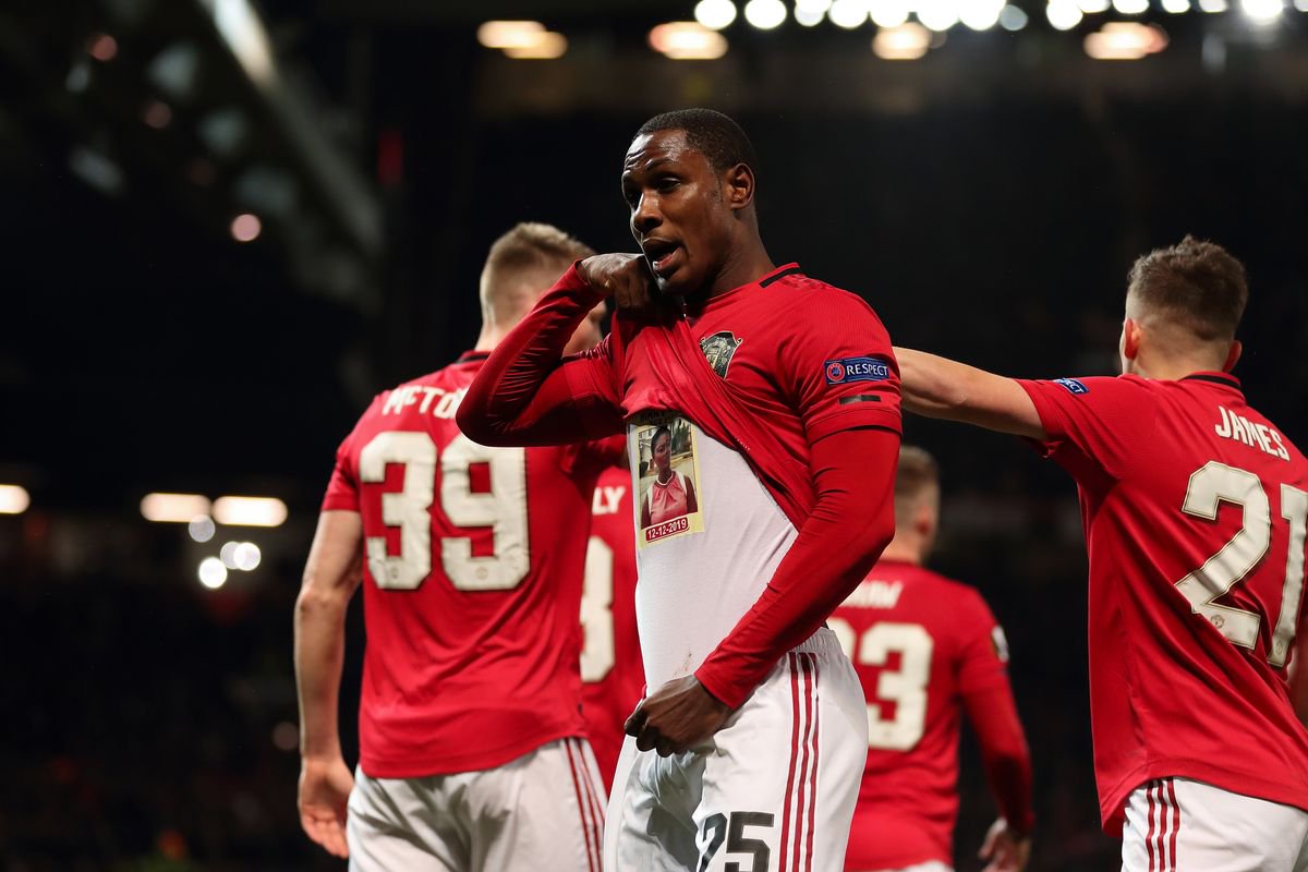 Odion Ighalo of Manchester United lifts his shirt to reveal a tribute to his sister while celebrating after scoring a goal to make it 2-0 during the UEFA Europa League round of 32 second leg match between Manchester United and Club Brugge at Old Trafford on February 27, 2020 in Manchester, United Kingdom.