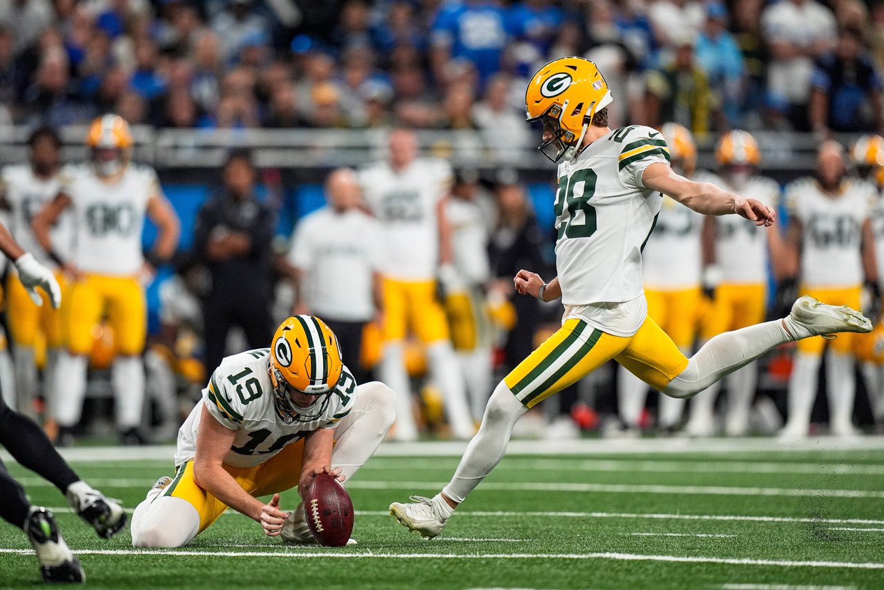 Green Bay Packers kicker Trey Smack (28) attempts a field goal against Detroit Lions during the first half at Ford Field in