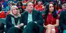 Ed O'Neill as Donald Sterling sitting with his wife and assistant in the crowd of a basketball game in Clipped