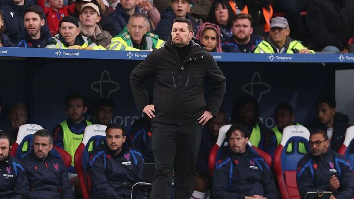Pierre Sage, manager of Crystal Palace, looks on