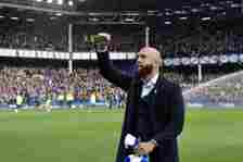 Former Everton Goalkeeper Tim Howard greets the fans during the Premier League match between Everton FC and Manchester United at Goodison Park on M...